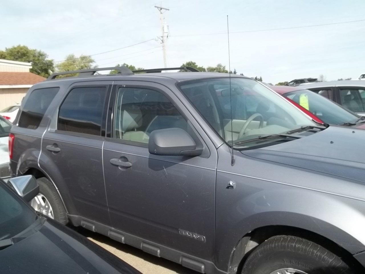 2008 Ford Escape Hybrid in Tungsten Grey Metallic — front three-quarter view