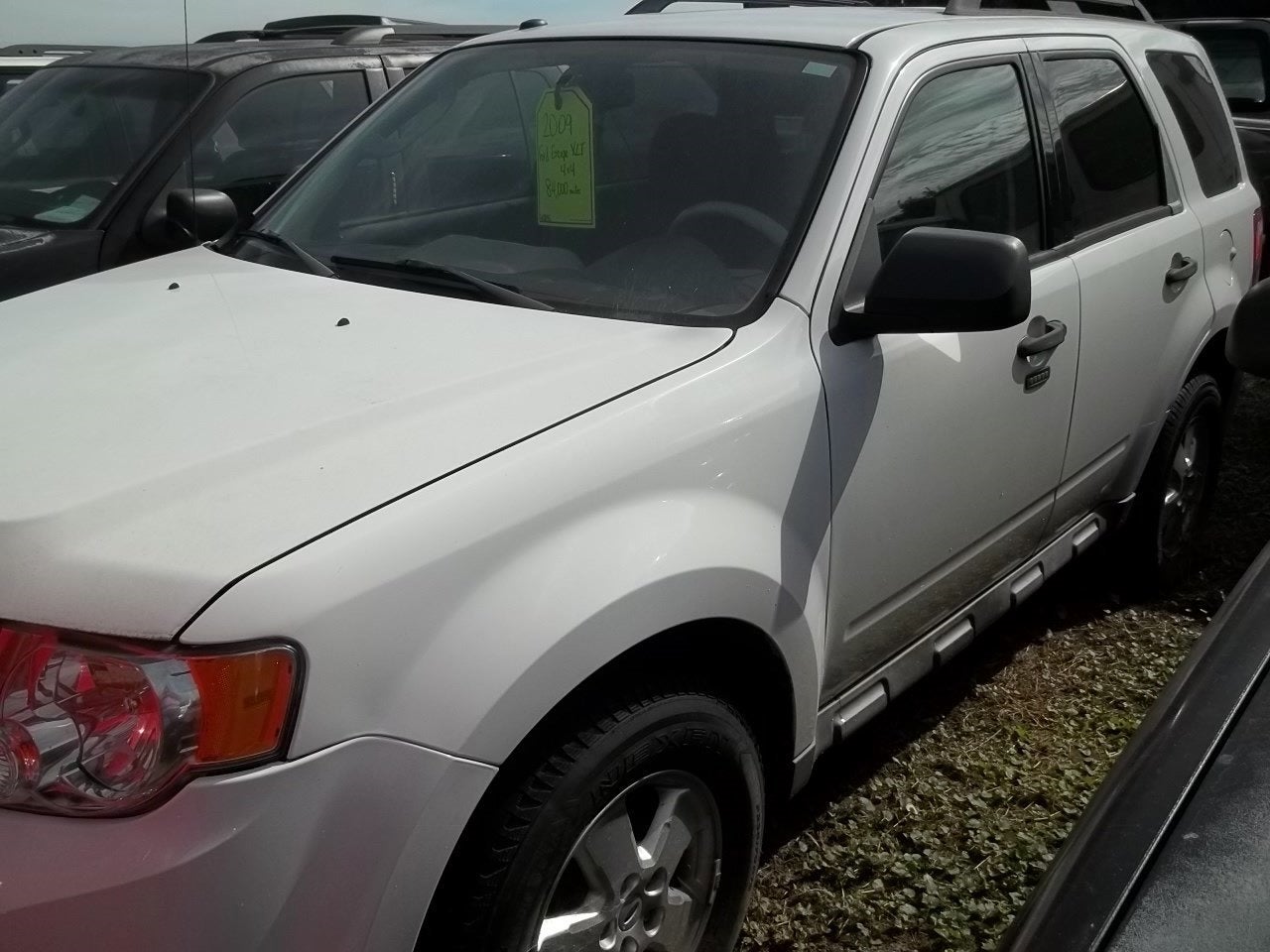 2009 Ford Escape XLT in Oxford White — front three-quarter view