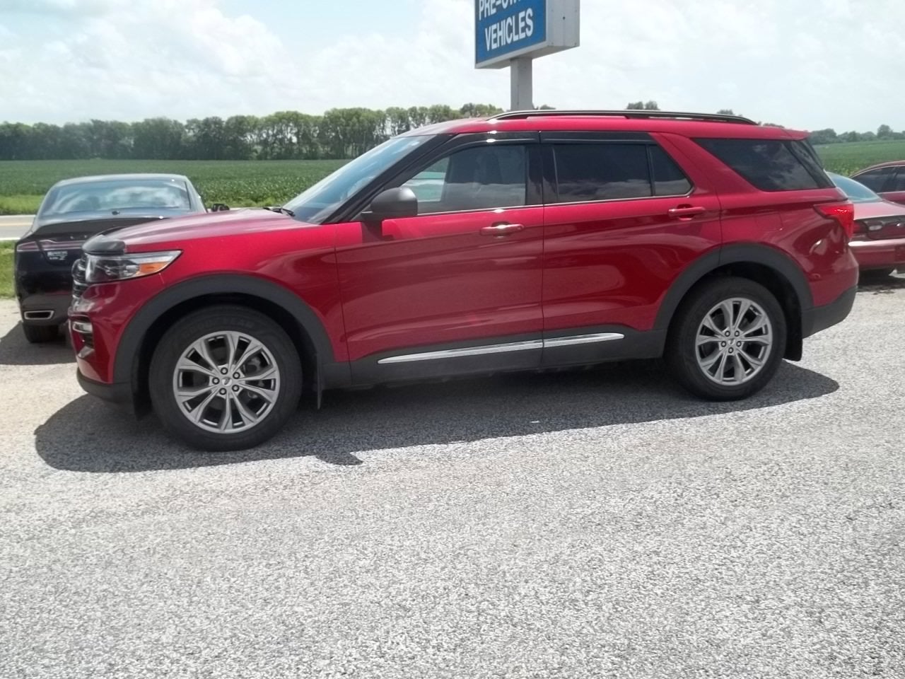2020 Ford Explorer XLT in Rapid Red Metallic Tinted Clearcoat — front three-quarter view