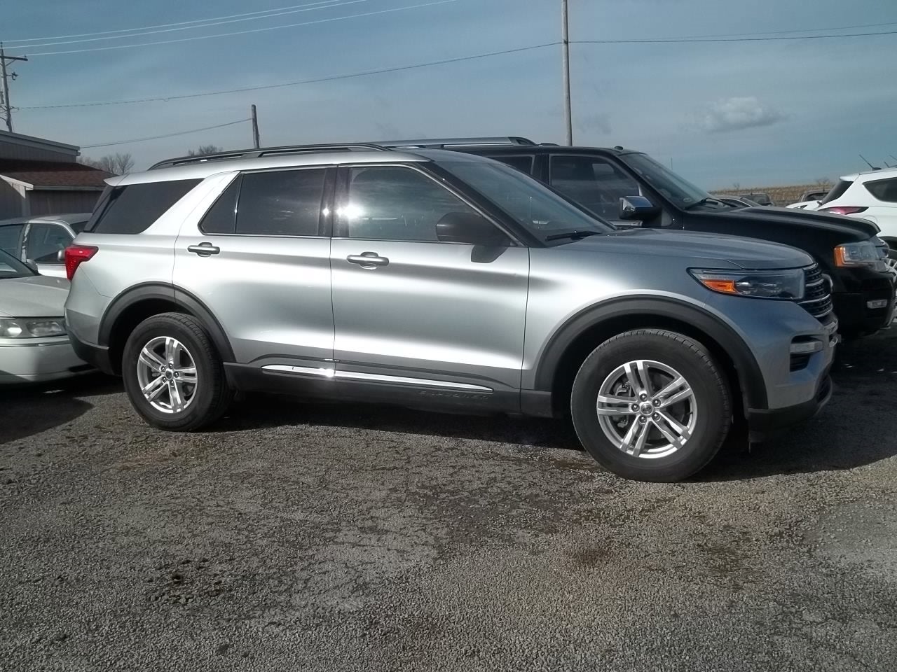 2020 Ford Explorer XLT in Iconic Silver Metallic — front three-quarter view