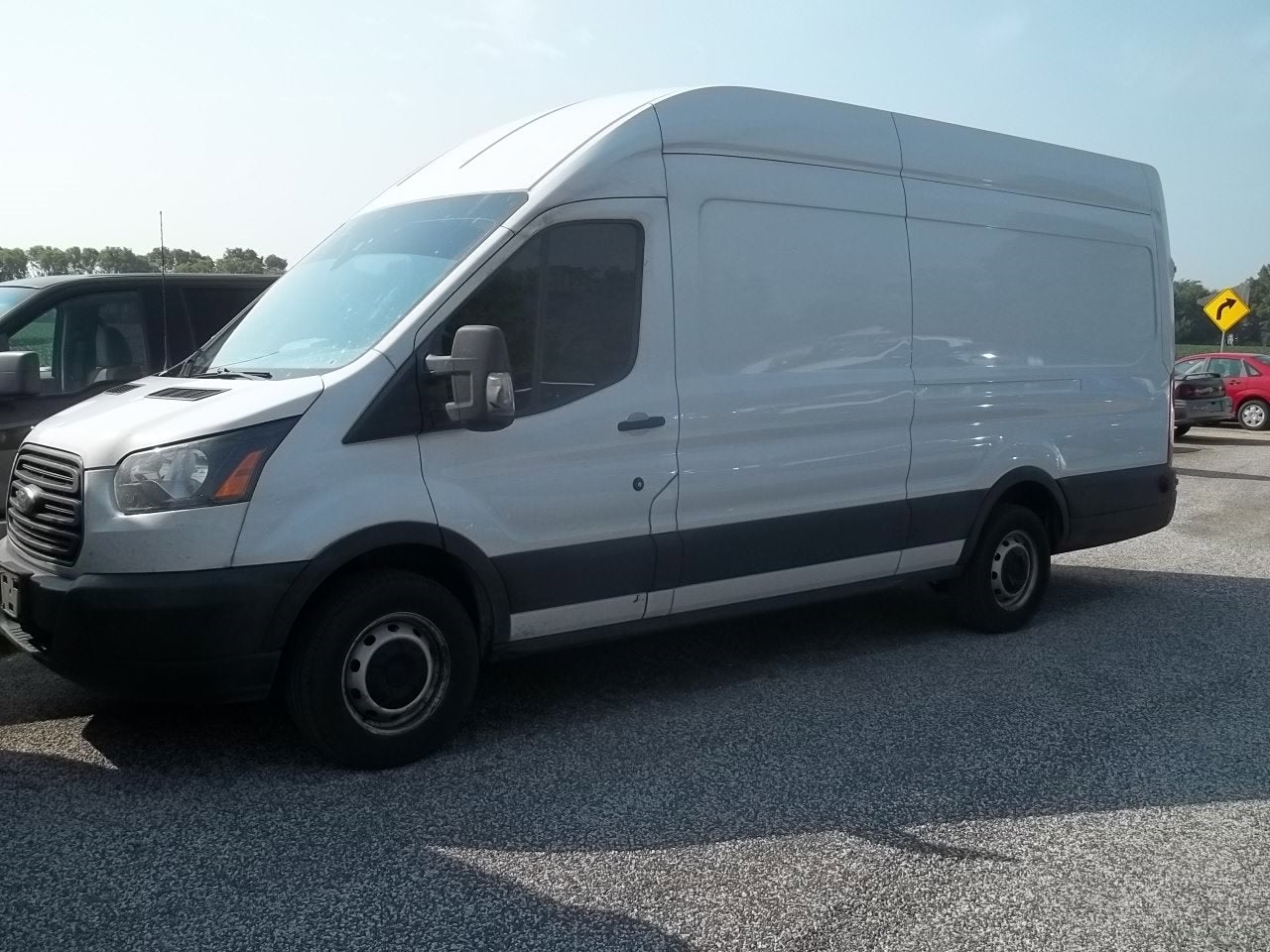 2019 Ford Transit Van 148 WB High Roof Extended Cargo in Oxford White — front three-quarter view