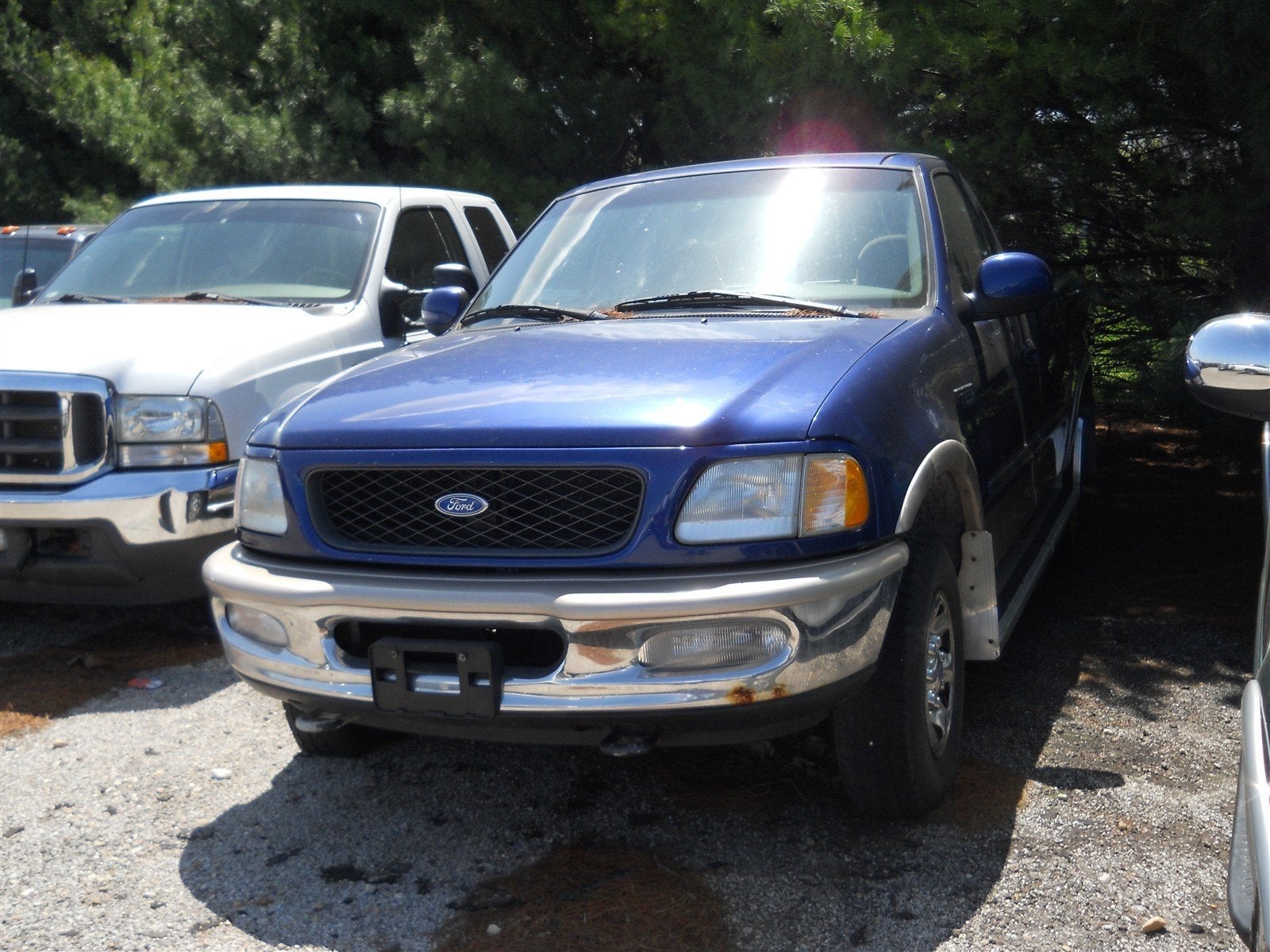 1997 Ford F-250 XLT in Portofino Blue (Cc/Met) — front three-quarter view