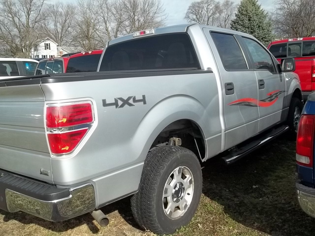 2010 Ford F-150 XLT in Ingot Silver — front three-quarter view