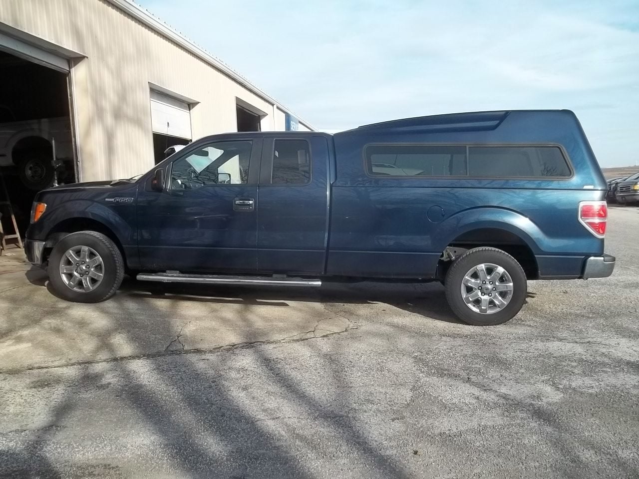 2014 Ford F-150 XLT in Blue Jeans Metallic — front three-quarter view