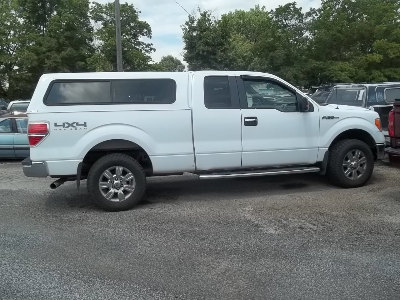 2011 Ford F-150 XLT in Oxford White — front three-quarter view