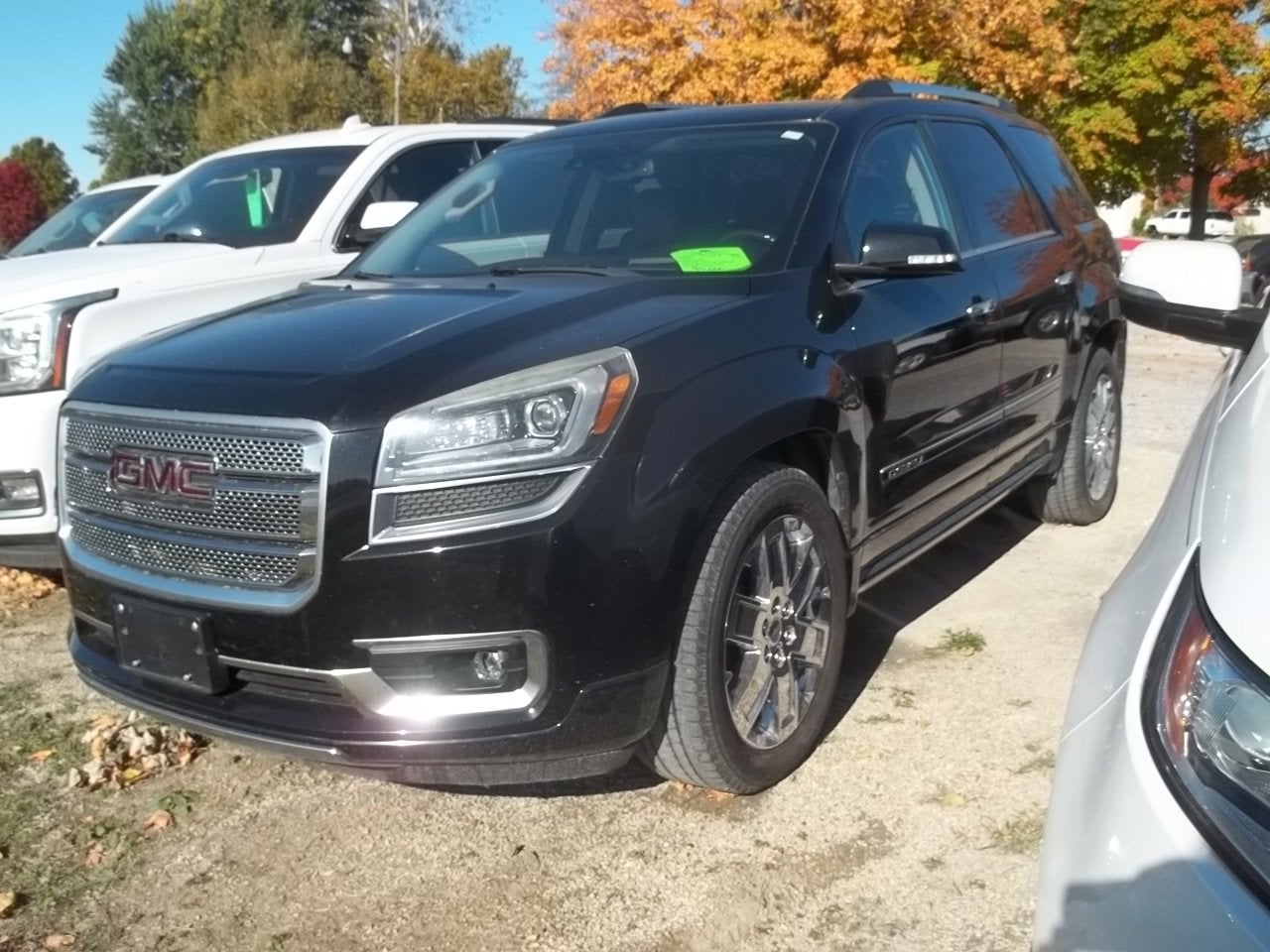 2016 GMC Acadia Denali in Ebony Twilight Metallic — front three-quarter view