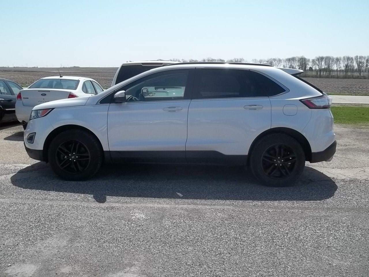 2018 Ford Edge SEL in White Platinum Metallic Tri-Coat — front three-quarter view