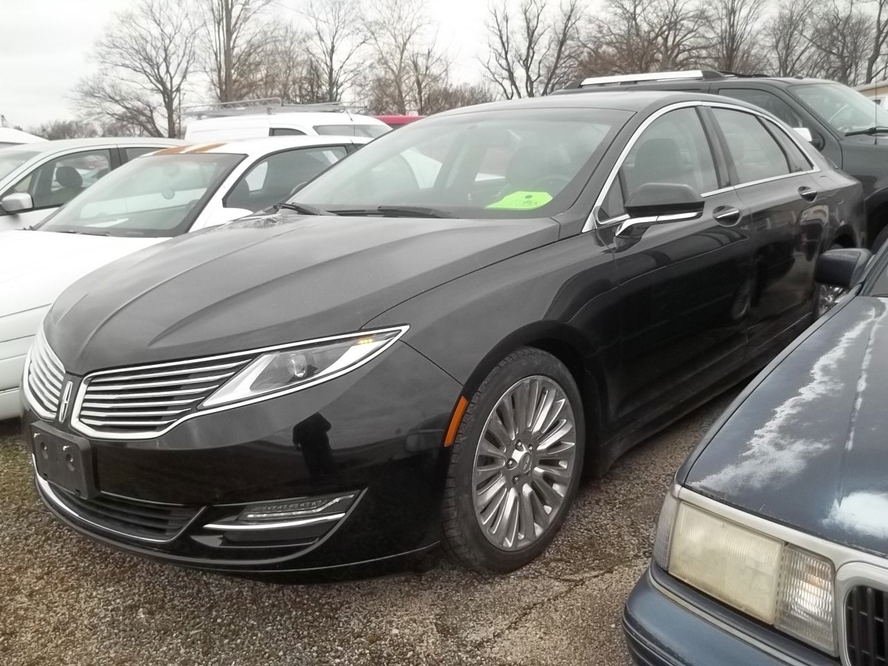 2014 Lincoln MKZ Base in Tuxedo Black — front three-quarter view